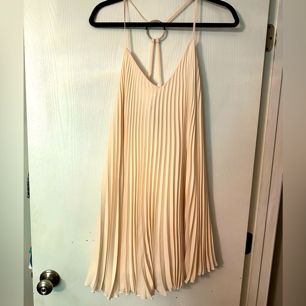 New with tags- cream colored pleated mini dress!